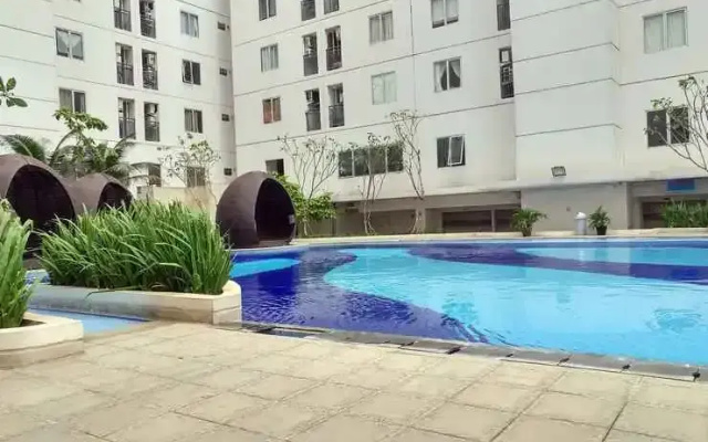 Best Startegic 2BR Apartment at Bassura City By Travelio