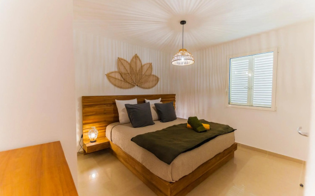 Le Baileys - Spacieux appartement en rez-de-jardin vue lagon