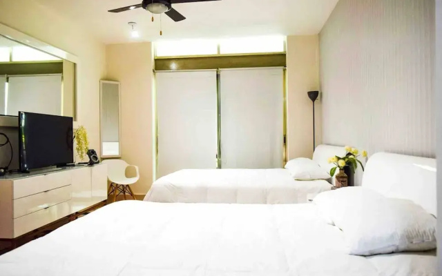 LUXURY CONDO STEPS FROM 5th AV & BEACH