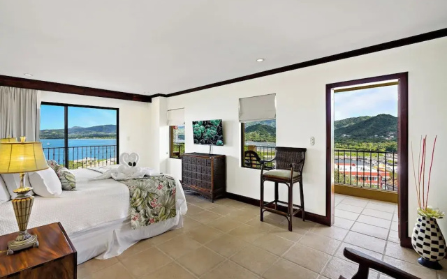 Remodeled Top-Floor Condo with Stunning Wrap-Around Balcony Offering Mountain, Ocean & Marina Views