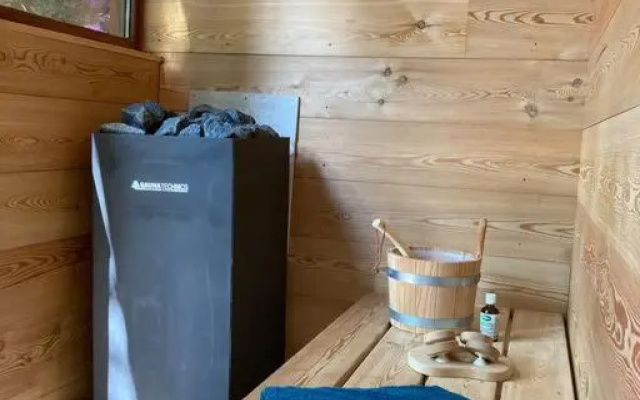 Houten bosvilla met sauna en 2 slaapkamers