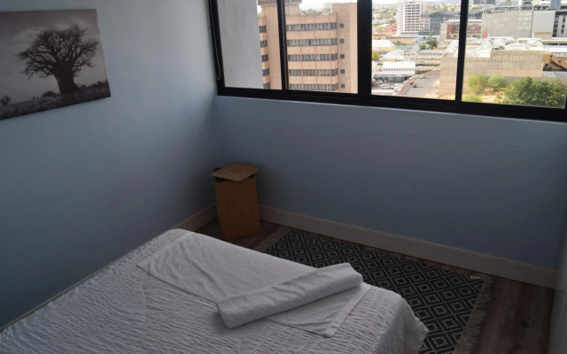 Highrise Windhoek apartment with skyline view, pool and gym