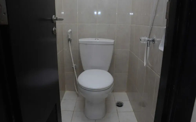 Comfy and Spacious 2BR The Masterpiece Epicentrum Apartment By Travelio
