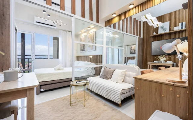Elegant Wood-accent Studio With Balcony