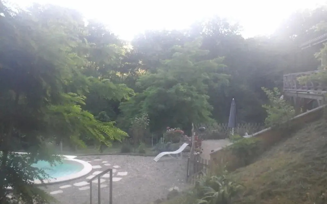 Apartment Facing the Pool in a Wooden House