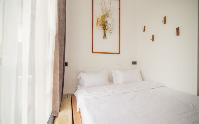 Отель Zaimushe Holiday Courtyard комната для гостей