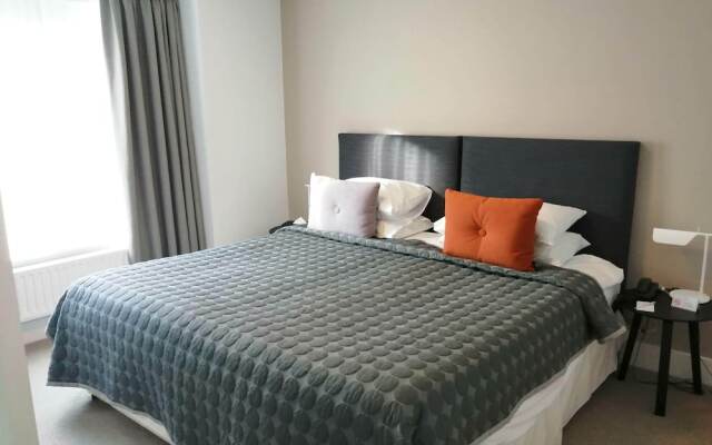 Апартаменты Monarch House Serviced Apartments Лондон вид на фасад