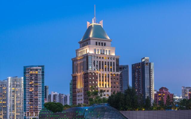 Отель Orchard Parksuites вид на фасад