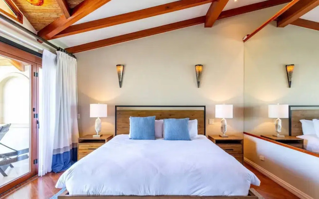 Stylish Split-Level Condo with a Shaded Terrace, Direct Beach Access, and Resort-Style Community Amenities