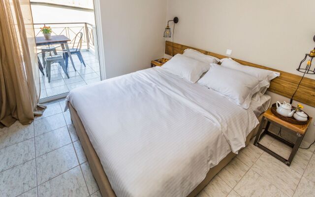 Отель Aris Athens Suites комната для гостей