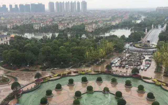 Qidong Warm House Apartment Hotel