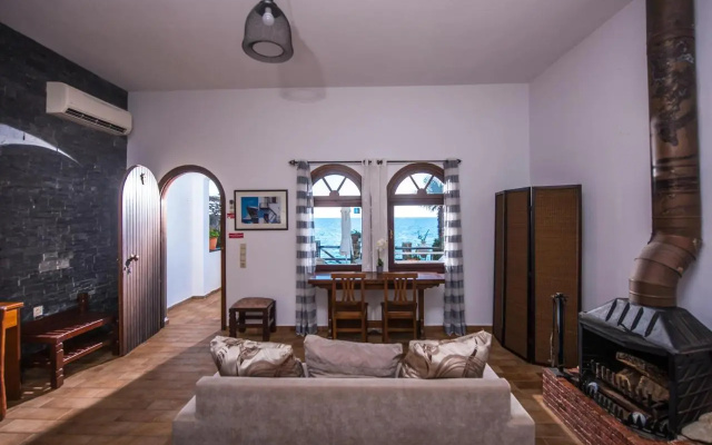 Exclusive Seaside Retreat with Shared Pool & Private Beach Access