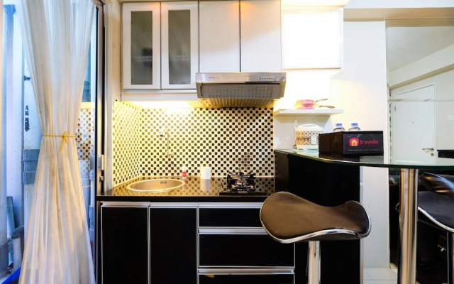 Monochrome Style 2 Bedrooms at Kalibata City Apartment By Travelio