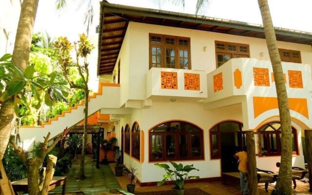 Отель Villa Paradise Хиккадува вид на фасад