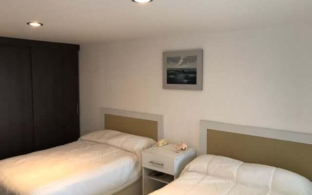Отель Departamento Real de Palmas комната для гостей