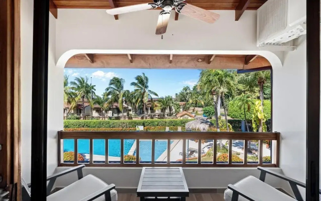 Stylish 2-Bedroom Beach Condo with Ocean-View Deck, Lush Pool Area & 2-Minute Walk to Flamingo Beach