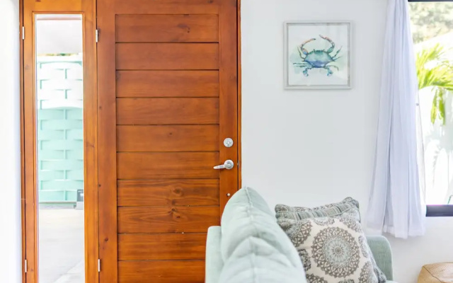 Ultramodern Townhome with an Inviting Coastal Design and Lush Outdoor Oasis with a Private Pool