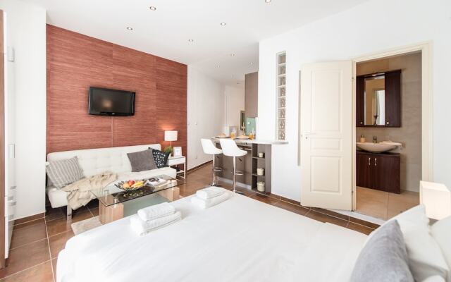 Апартаменты Oasis Apartments - Fashion Street комната для гостей