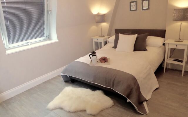 Апартаменты Boutique Beach Apartments комната для гостей