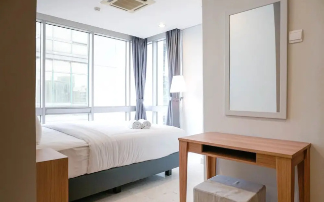Cozy 2BR at Empyreal Epicentrum Apartment By Travelio