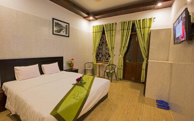 Отель The Village Homestay Хойан комната для гостей