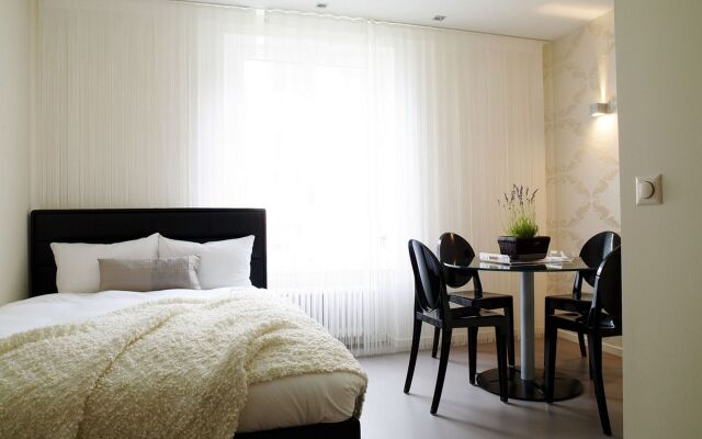 Отель VISIONAPARTMENTS Zurich Waffenplatzstrasse Швейцария, Цюрих - отзывы, цены и фото номеров - забронировать отель VISIONAPARTMENTS Zurich Waffenplatzstrasse онлайн комната для гостей