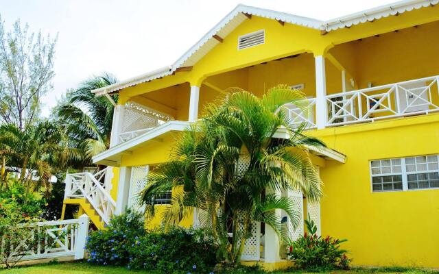 Отель Beachcombers Hotel Сент-Винсент и Гренадины, Остров Бекия - отзывы, цены и фото номеров - забронировать отель Beachcombers Hotel онлайн вид на фасад