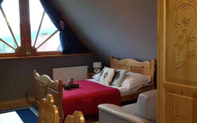 Domek za Strugiem - pokoje i apartamenty