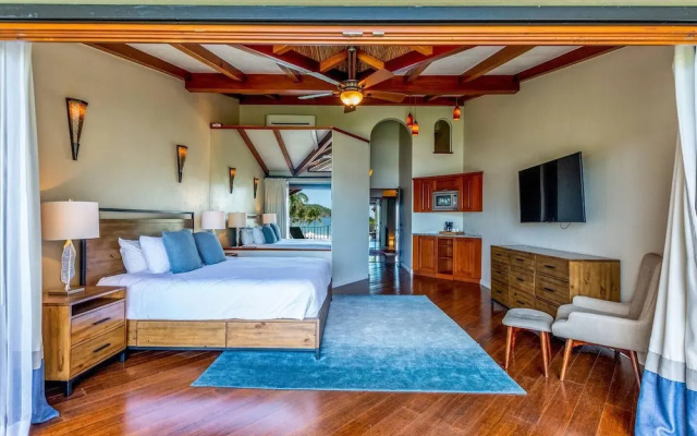 Stylish Split-Level Condo with a Shaded Terrace, Direct Beach Access, and Resort-Style Community Amenities