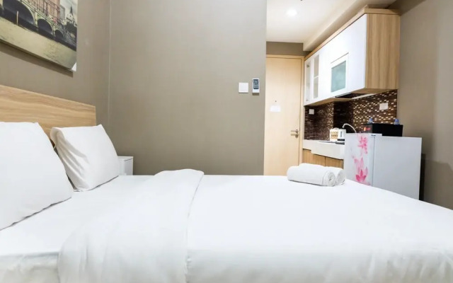 Cozy Studio Tree Park Apartment Near Ice BSD by Travelio
