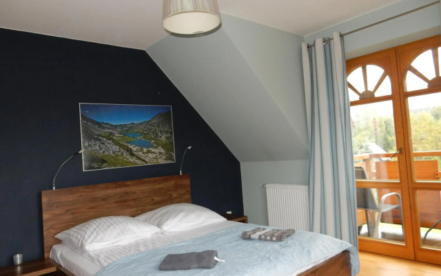 Domek za Strugiem - pokoje i apartamenty