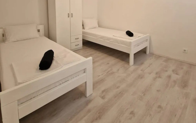 Four Bedroom apt w Patio Close to Beach and Center