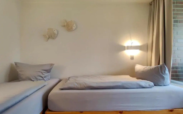 Ferienwohnung-11-mit-Terrasse-und-Strandkorb-am-Strand-Haus-Hohe-Worth-Duhnen