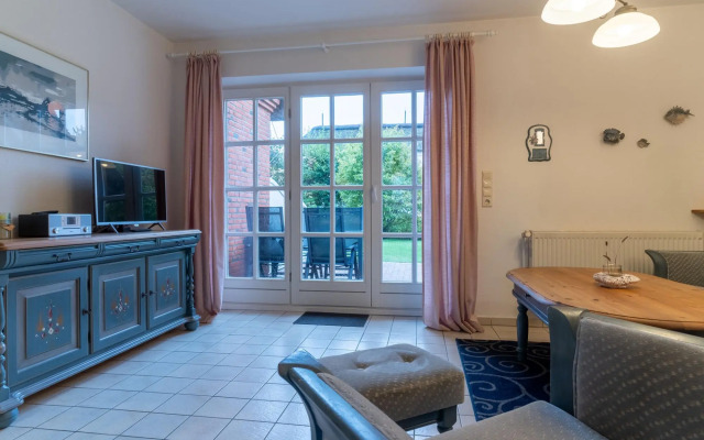 Holiday apartment with a fireplace in a thatched apartment house