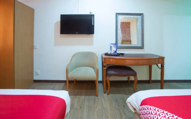 Capital O Hotel Grand Orchard