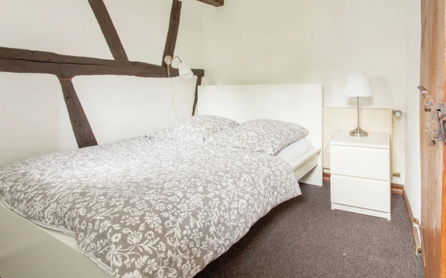A Lovely Watermill Surrounded by Delightful Greenery
