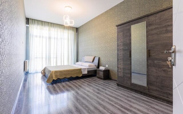 Апартаменты Apartment on Saakadze Square Тбилиси комната для гостей