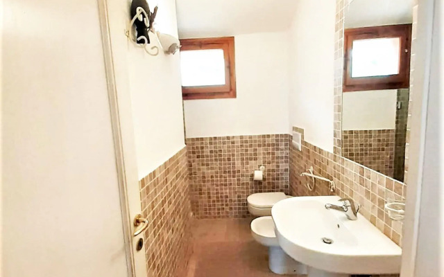 Charming Holiday Home in Marinella With Shared Garden
