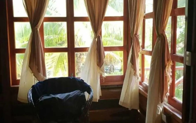 Cabanas k'iin Yéetel Há Bacalar