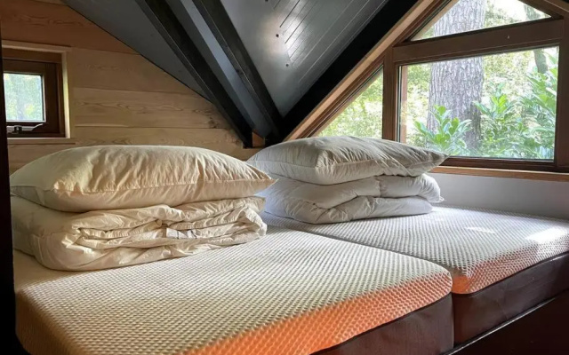 Houten bosvilla met sauna en 2 slaapkamers