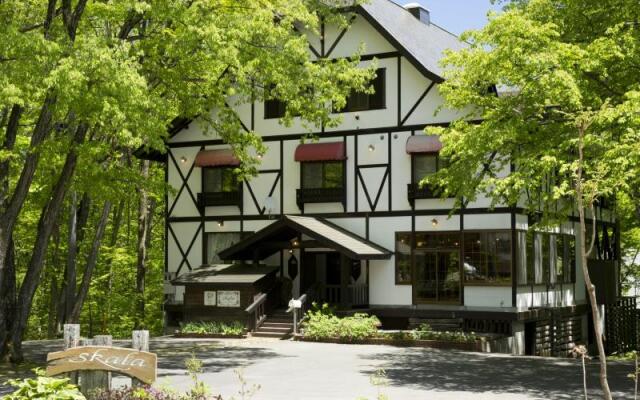Отель Grove Inn Skala Хакуба вид на фасад