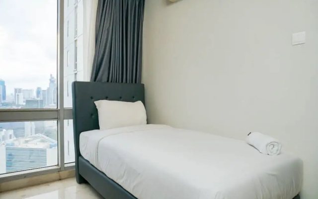 Cozy 2BR at Empyreal Epicentrum Apartment By Travelio