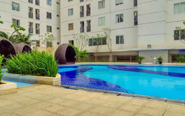 Modern 2BR with City View at Bassura Apartment By Travelio