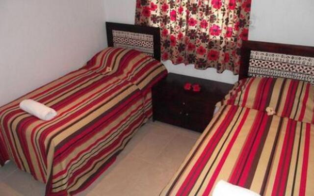 Апартаменты Hibiscus Apartments комната для гостей