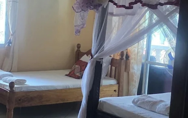 Luxurious 4-bedroom Holiday House With Pool Access in Diani Beach