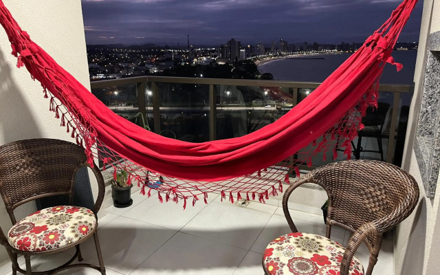 Apartamento novo frente mar com piscina aquecida em Home Club