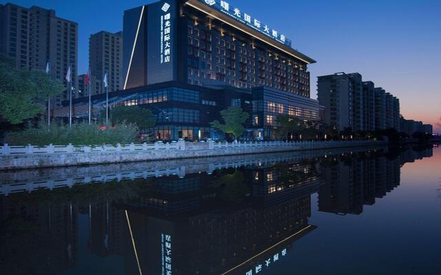 Shuguang International Hotel Kunshan вид на фасад