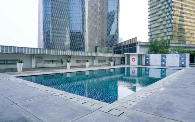 2BR Cozy at Empyreal Epicentrum Apartment By Travelio