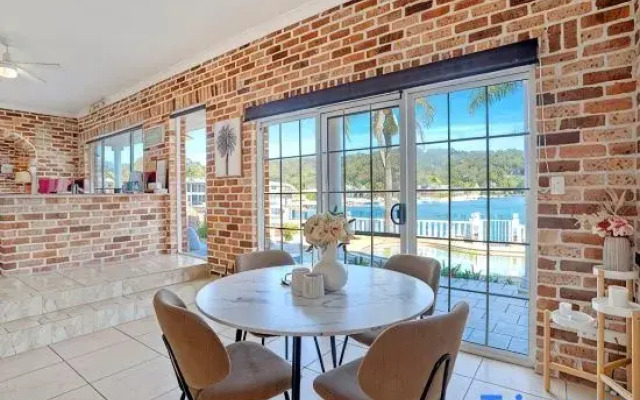 Stunning 4BR Holiday Home with Water Views & Pool