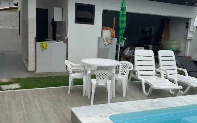Quarto na praia com cama de casal